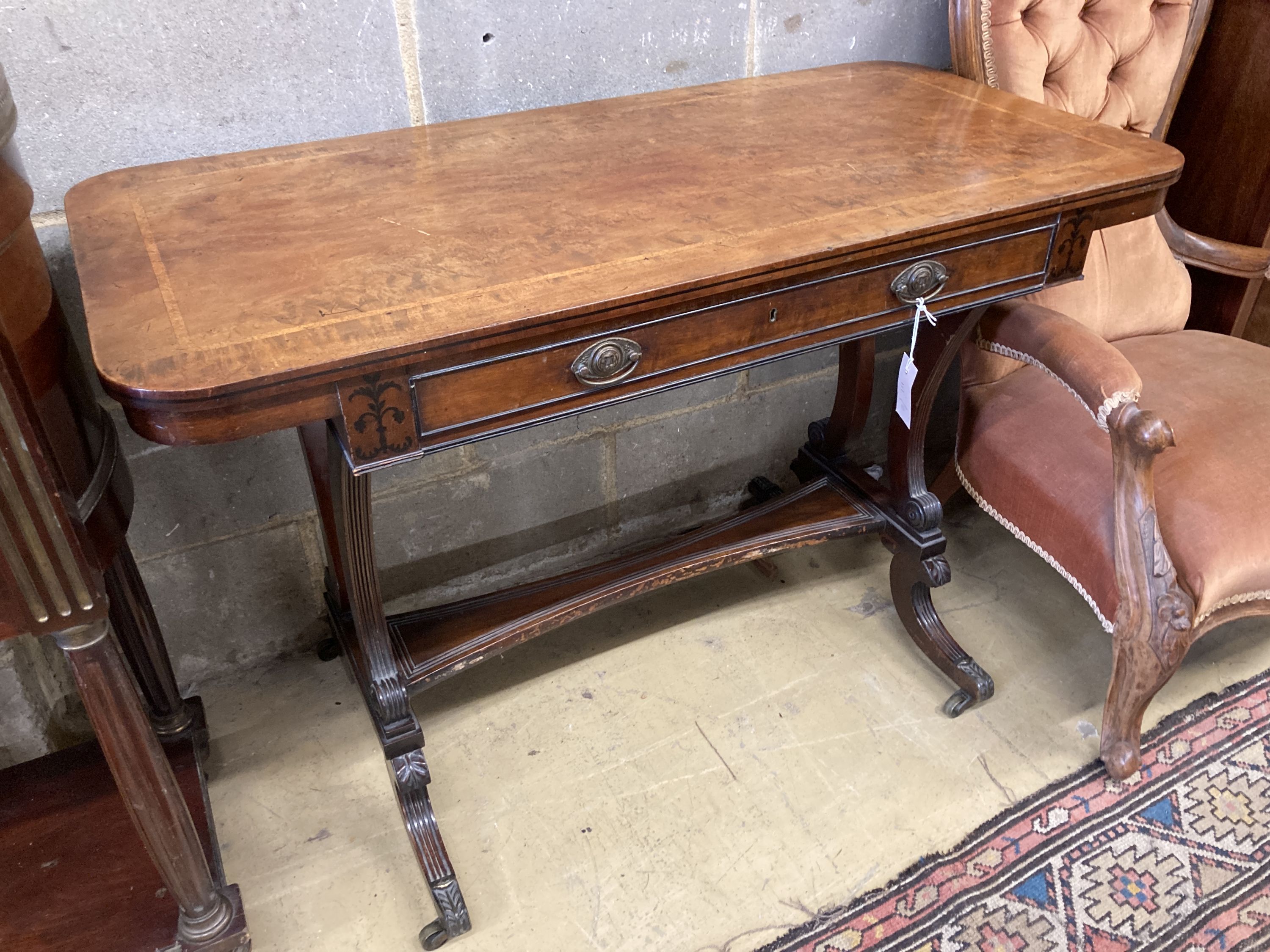 A Regency banded and ebony inlaid walnut writing table, width 106cm, depth 52cm, height 73cm